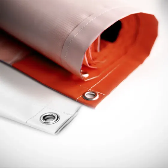 Close-up of a rolled PVC banner showing a metal eyelet set into the hemmed edge