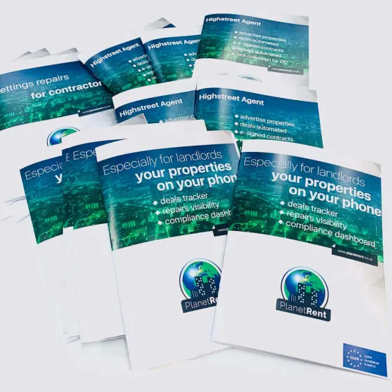 Stack of PlanetRent lettings brochures fanned out, showing three different covers