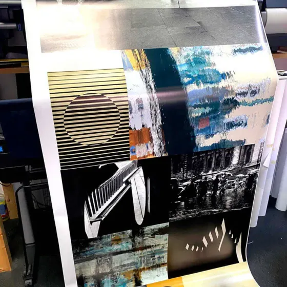 Large format print coming off the roll printer in the production room