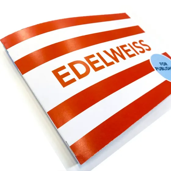 Saddle stitched brochure with a red and white striped Edelweiss cover