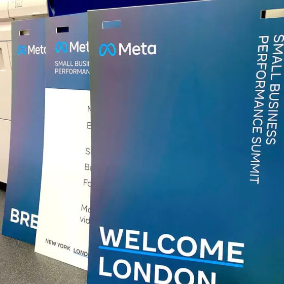 Blue Meta-branded exhibition boards reading Welcome London at a conference entrance