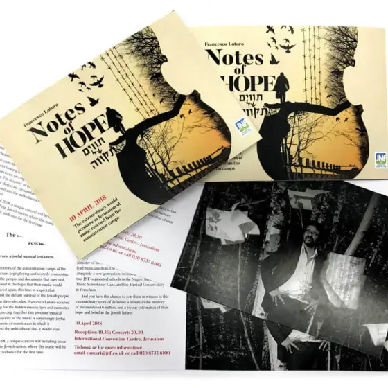 Printed concert flyers fanned out with a black and white photographic card beside them