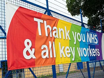 Printed PVC banner with hemmed edges and metal eyelets