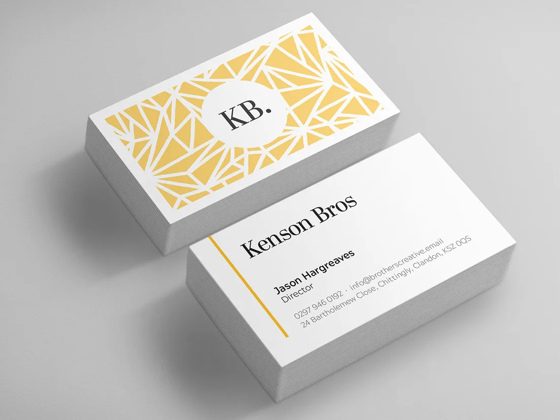 Green business card printed with a QR code, on a green cutting mat