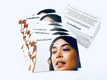 Fanned postcards printed with a portrait photograph, printed text visible on the reverse