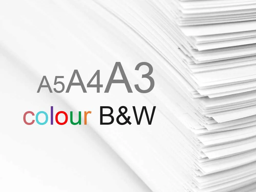 Large stack of printed documents with the words A5 A4 A3 colour and black and white overlaid