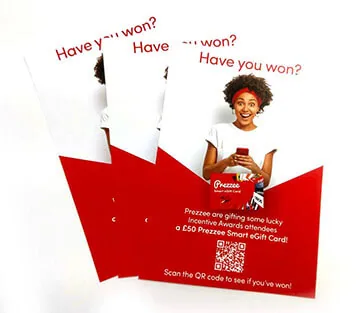 Red campaign flyers reading Have you heard, fanned out with a photograph of a person