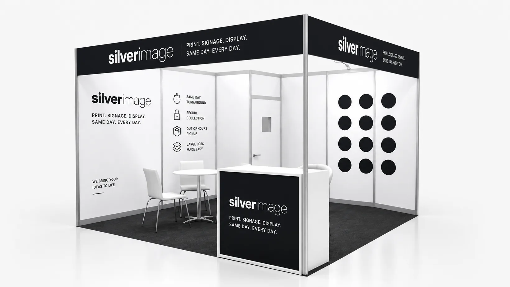 Exhibition shell scheme stand with printed wall panels and a branded counter