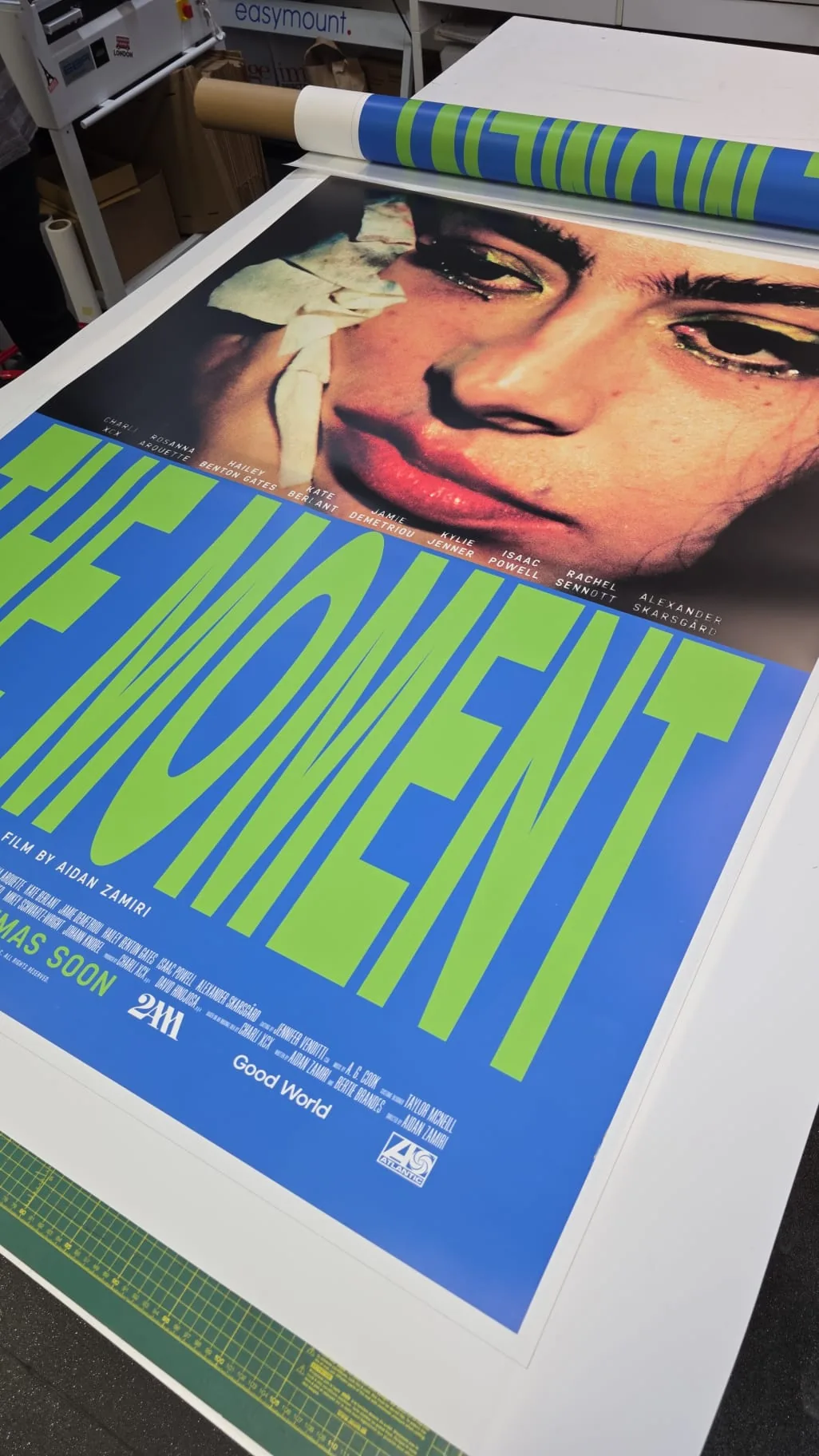 Film campaign poster coming off the laminator, printed and finished overnight in London.