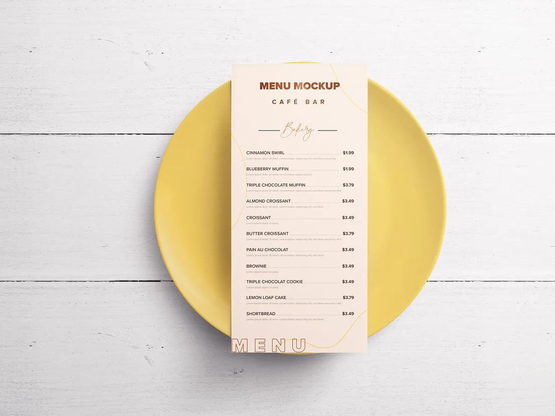 Printed menu card resting on a round yellow plate on a white table