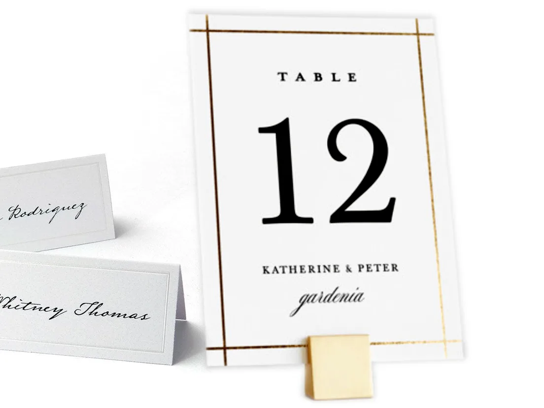 Place card resting on a plate at a laid table setting