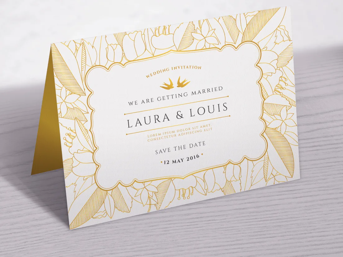 White folded place card printed Kelly Parker with a gold edge