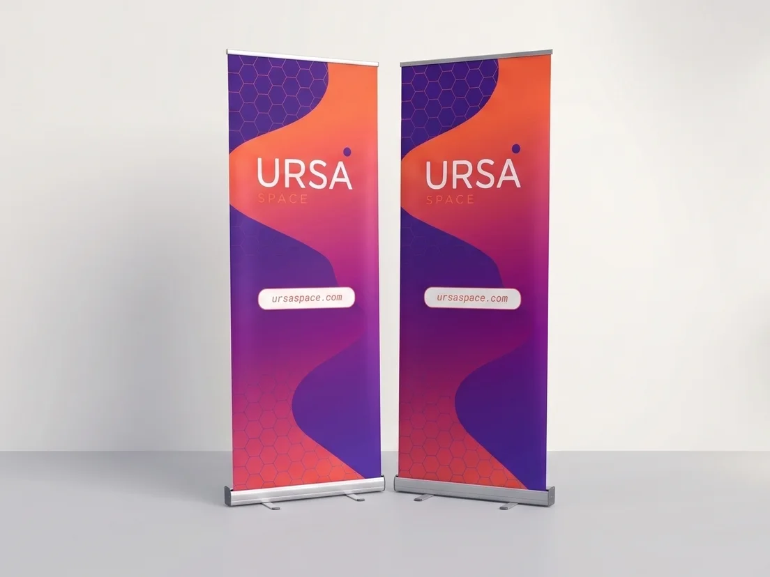 Two matching roller banners with a purple and orange gradient design, standing side by side