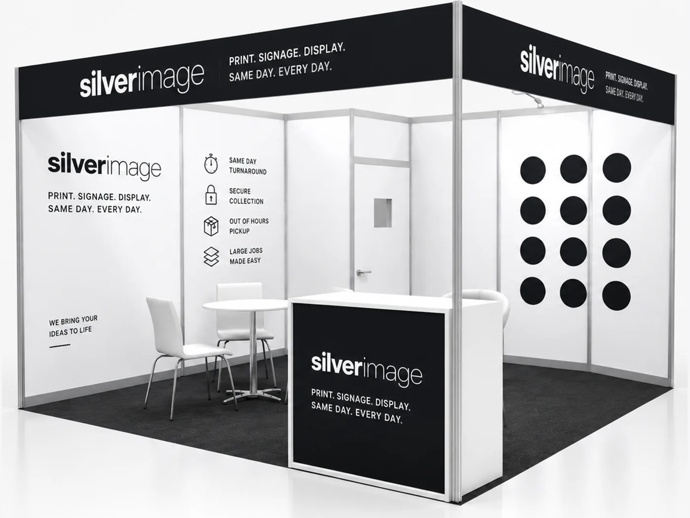 Exhibition shell scheme stand with printed wall panels and a branded counter