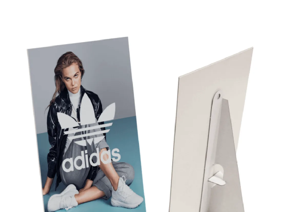 Adidas fashion display card shown front and back, the folded easel strut visible on the reverse