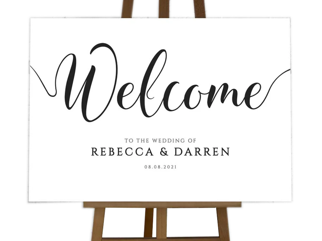 Welcome board with the names Rebecca and Darren in script, on a wooden easel